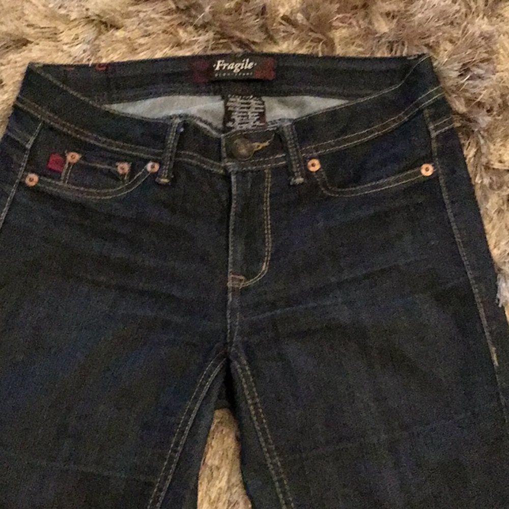 Fragile blue jeans